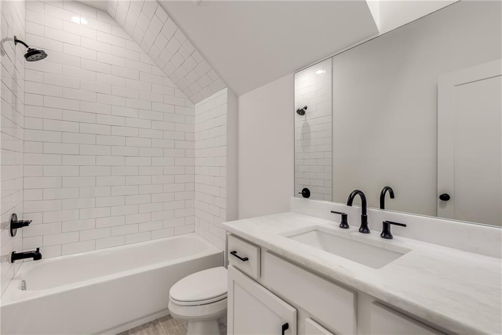 628 Robinson Avenue Southeast, Unit B Atlanta, GA 30312 - Photo 46 of 77 a bathroom with a sink a toilet and shower