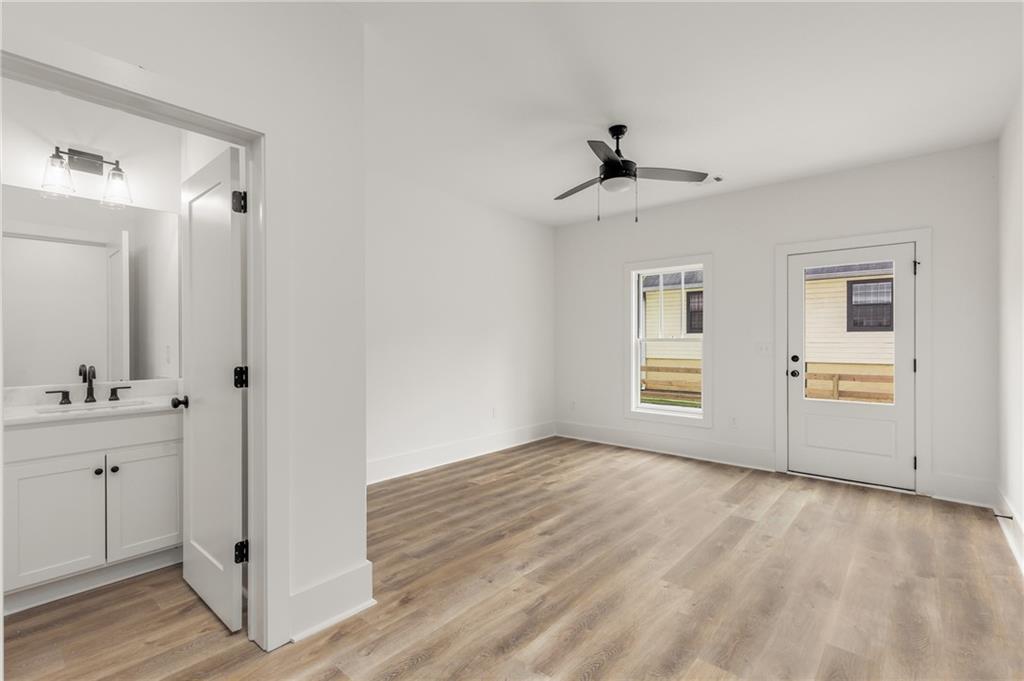 628 Robinson Avenue Southeast, Unit B Atlanta, GA 30312 - Photo 50 of 77 a view of an empty room with window and wooden floor