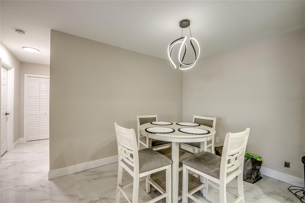 2544 First Street, Unit 107 Fort Myers, FL 33901 - Photo 13 of 35 a table and chairs in a room