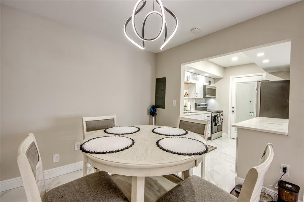 2544 First Street, Unit 107 Fort Myers, FL 33901 - Photo 14 of 35 a view of a dining room with furniture