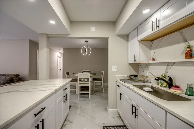 a kitchen with a sink and cabinets