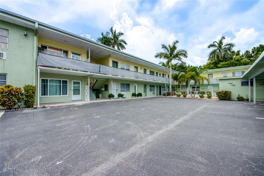 2544 First Street, Unit 107 Fort Myers, FL 33901 - Photo 3 of 35 a view of a building with a garden