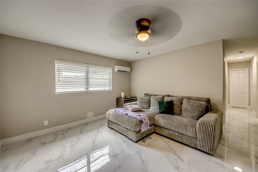 2544 First Street, Unit 107 Fort Myers, FL 33901 - Photo 6 of 35 a living room with furniture and a window