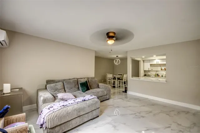 a spacious bedroom with a bed and window