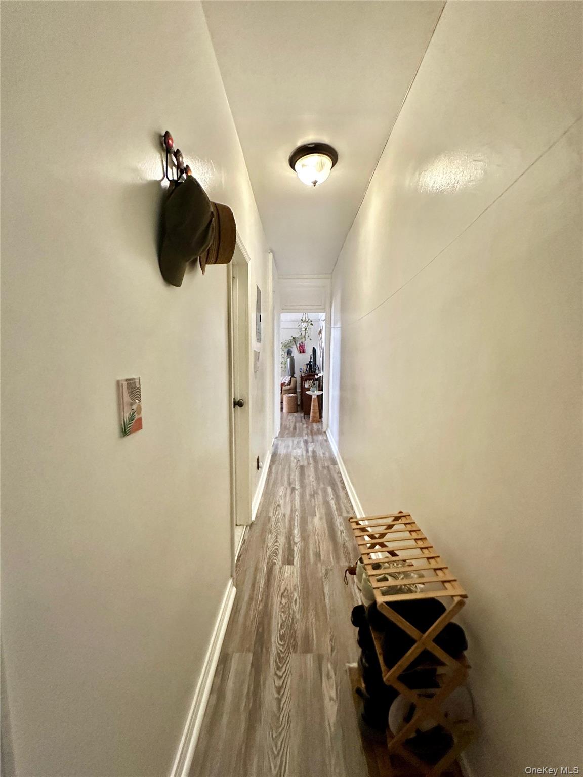 543 West 160th Street, Unit 5D Manhattan, NY 10032 - Photo 12 of 13 a bedroom with a bed and a chandelier