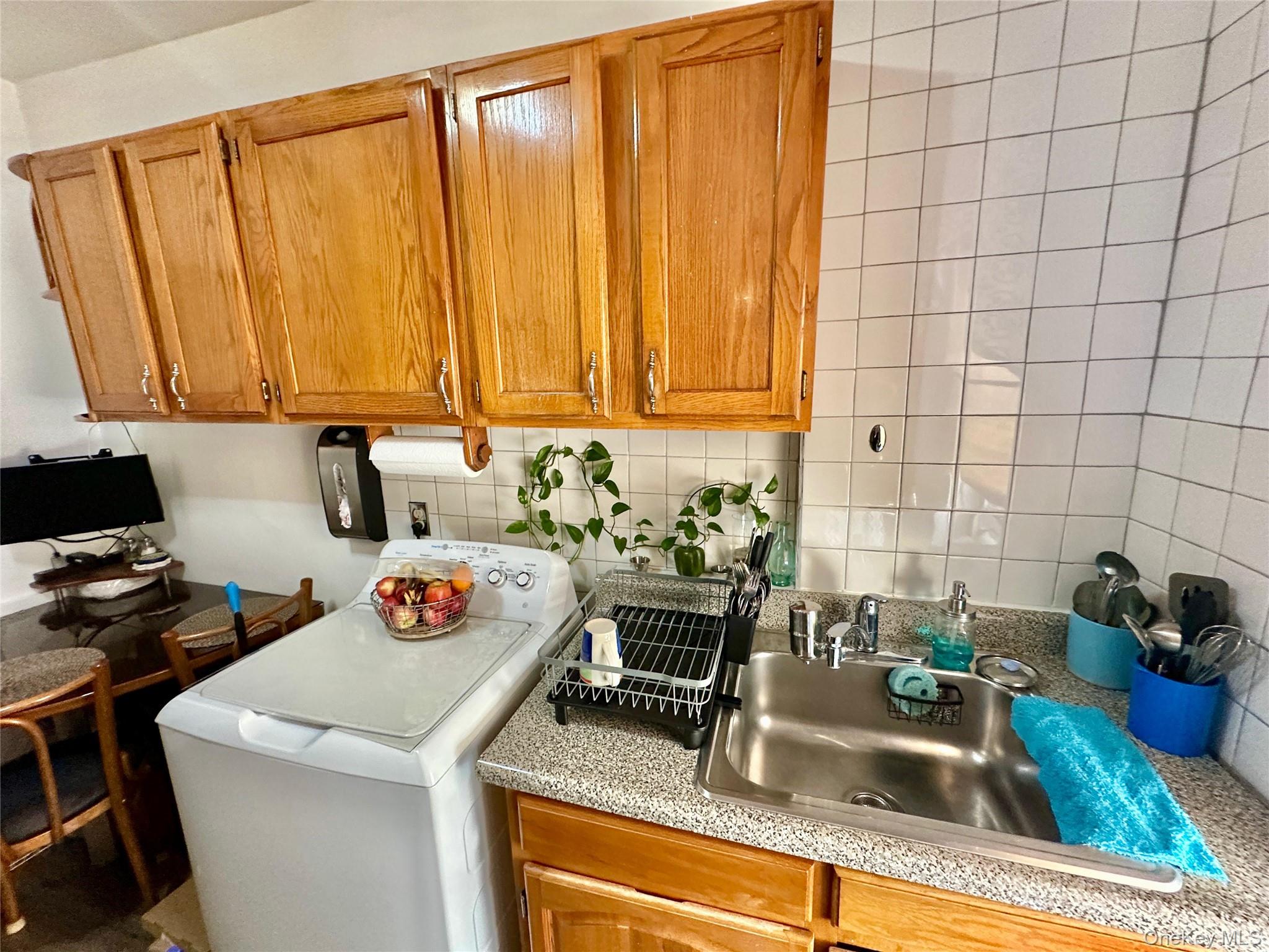 543 West 160th Street, Unit 5D Manhattan, NY 10032 - Photo 7 of 13 a kitchen with a sink and a stove top oven