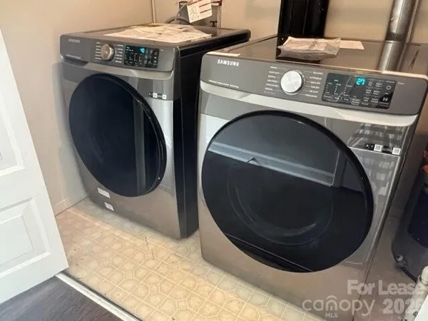 a utility room with dryer and washer