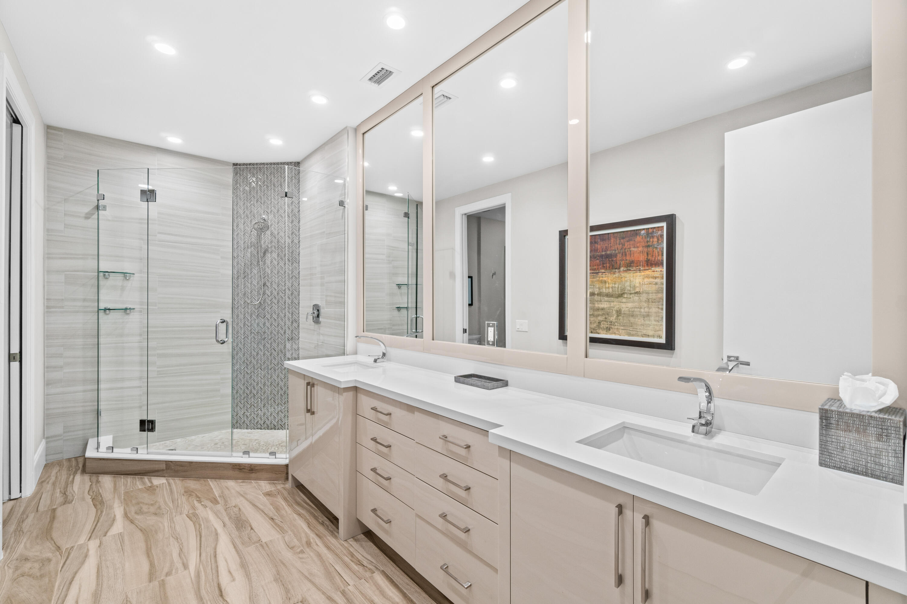 17629 Ashbourne Lane, Unit A Boca Raton, FL 33496 - Photo 18 of 35 a bathroom with a double vanity sink mirror double and shower