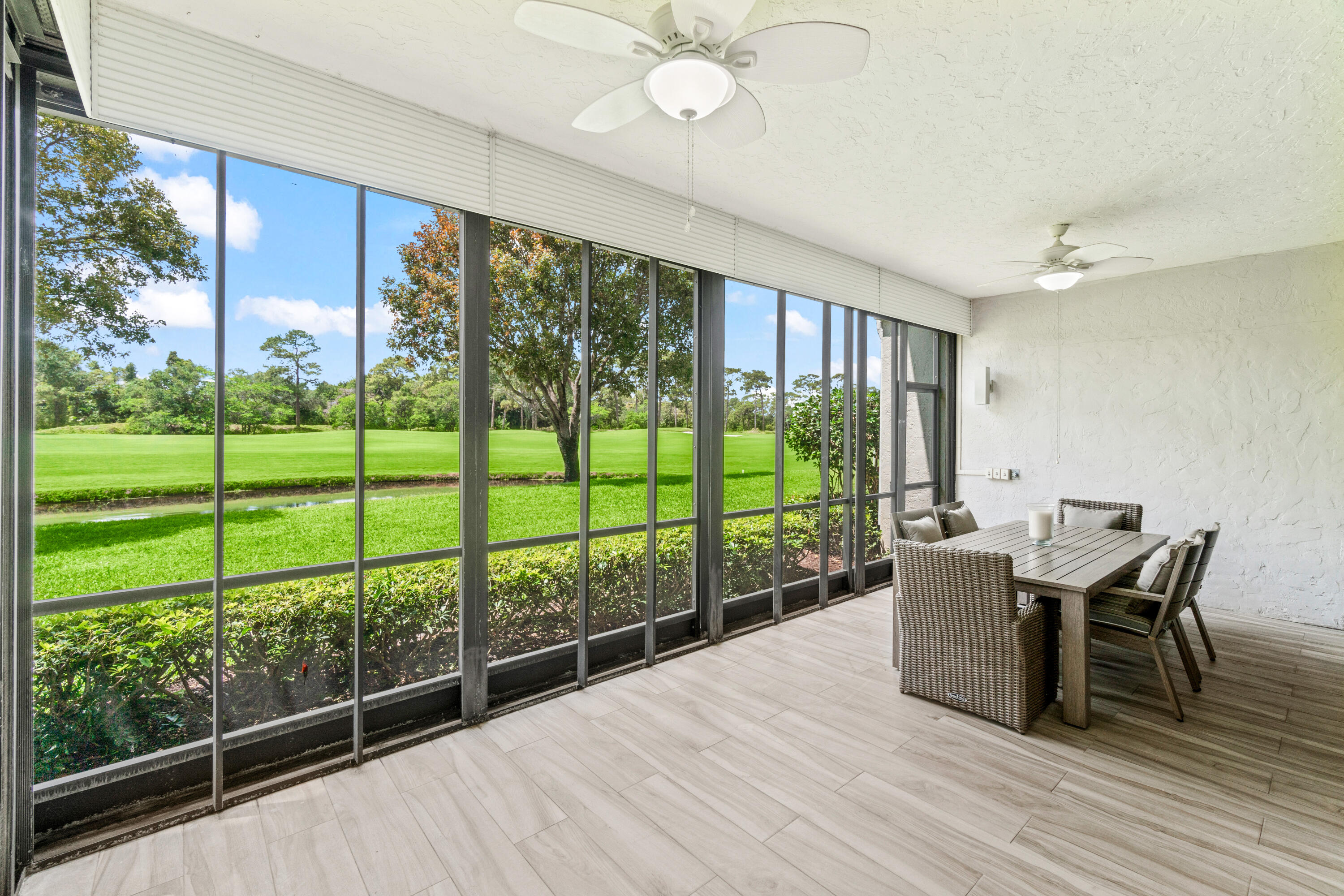 17629 Ashbourne Lane, Unit A Boca Raton, FL 33496 - Photo 26 of 35 a view of a dining room with furniture window and wooden floor