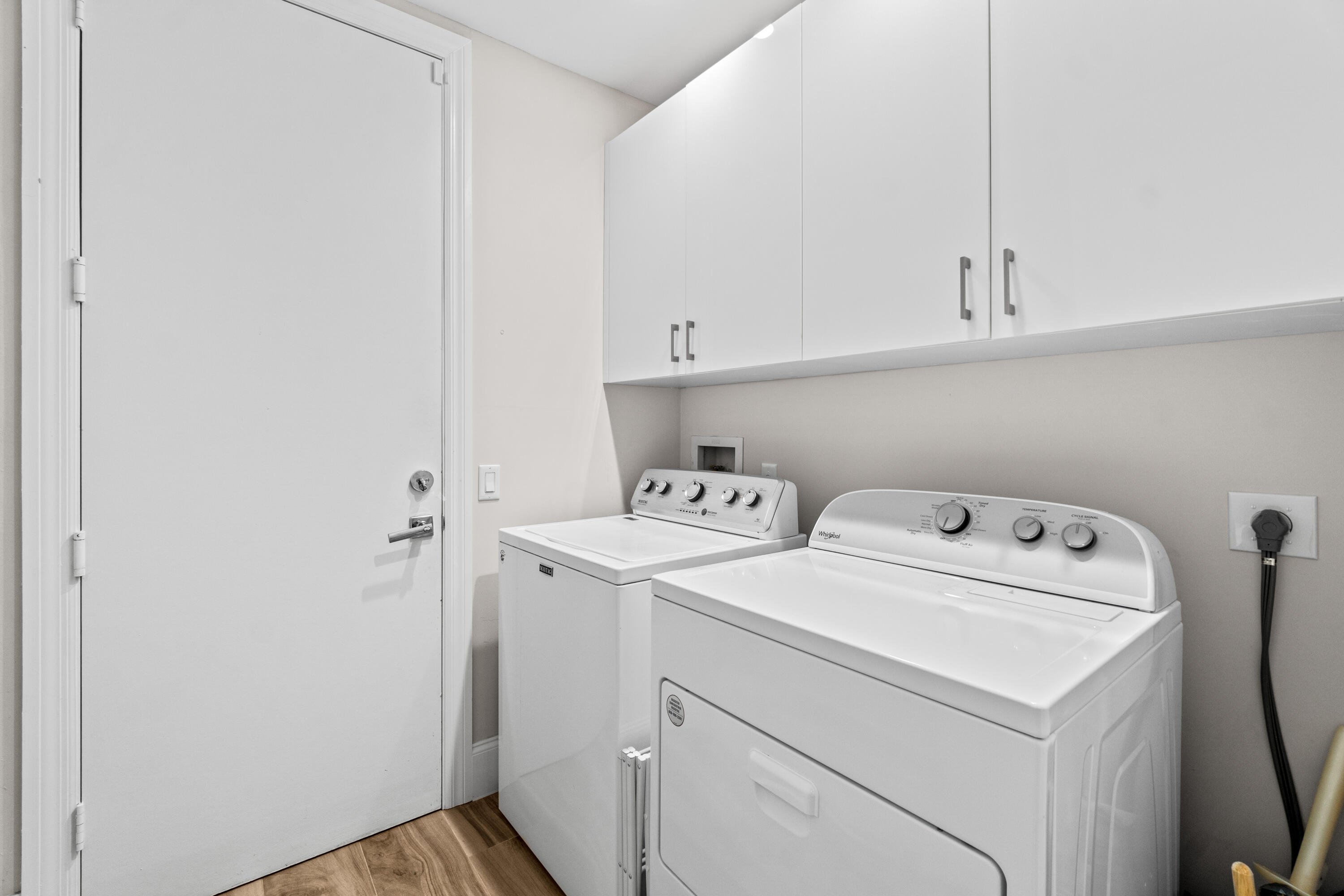 17629 Ashbourne Lane, Unit A Boca Raton, FL 33496 - Photo 31 of 35 a view of storage and utility room with washer and dryer