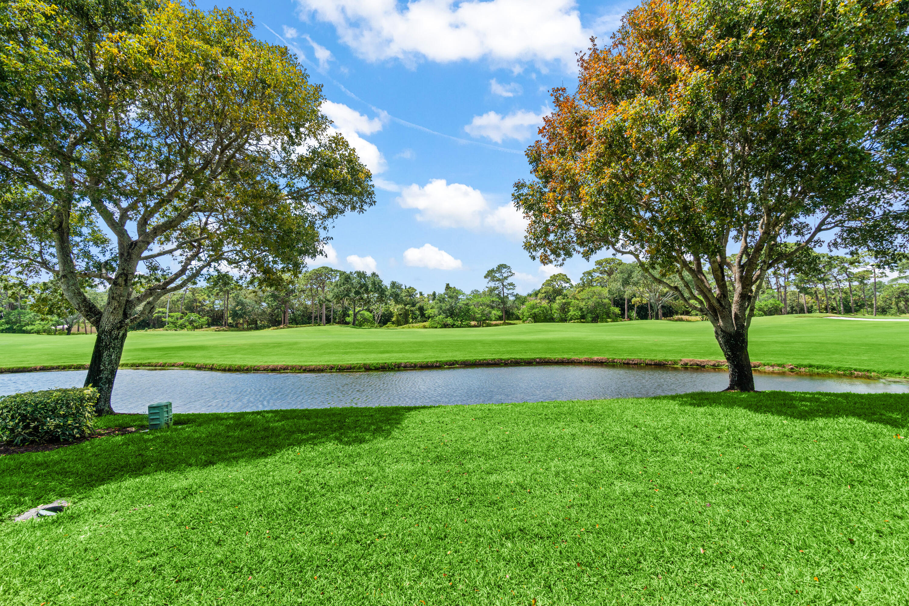 17629 Ashbourne Lane, Unit A Boca Raton, FL 33496 - Photo 34 of 35 a view of green field with trees