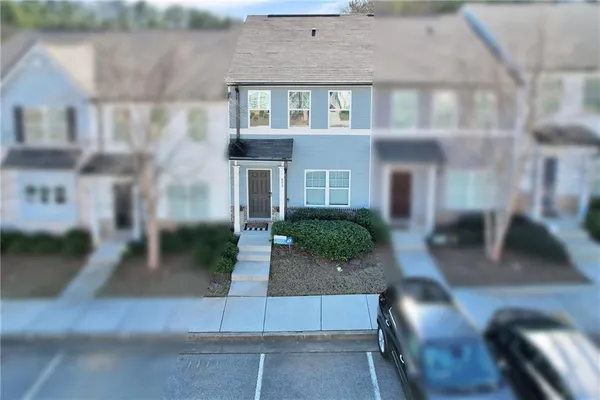 a front view of a house with yard