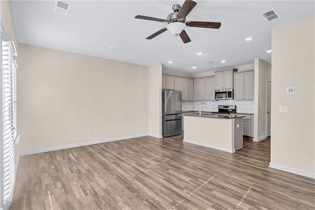 585 McWilliams Road Southeast, Unit 903 Atlanta, GA 30315 - Photo 15 of 37 a view of kitchen with granite countertop cabinets and refrigerator