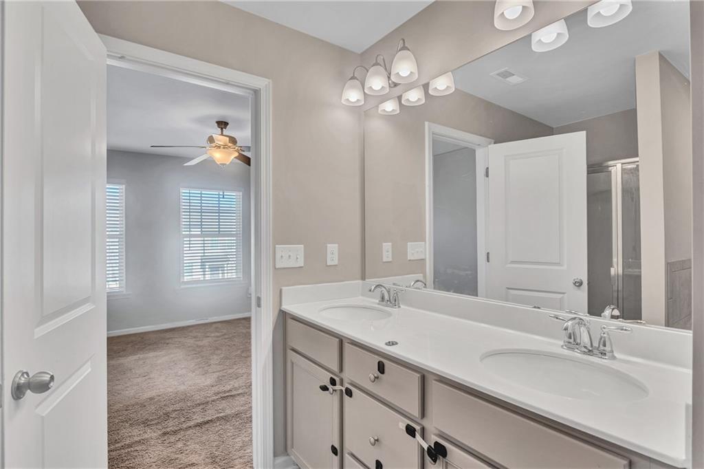 585 McWilliams Road Southeast, Unit 903 Atlanta, GA 30315 - Photo 23 of 37 a bathroom with a sink vanity and mirror