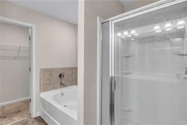 a bathroom with a glass shower door