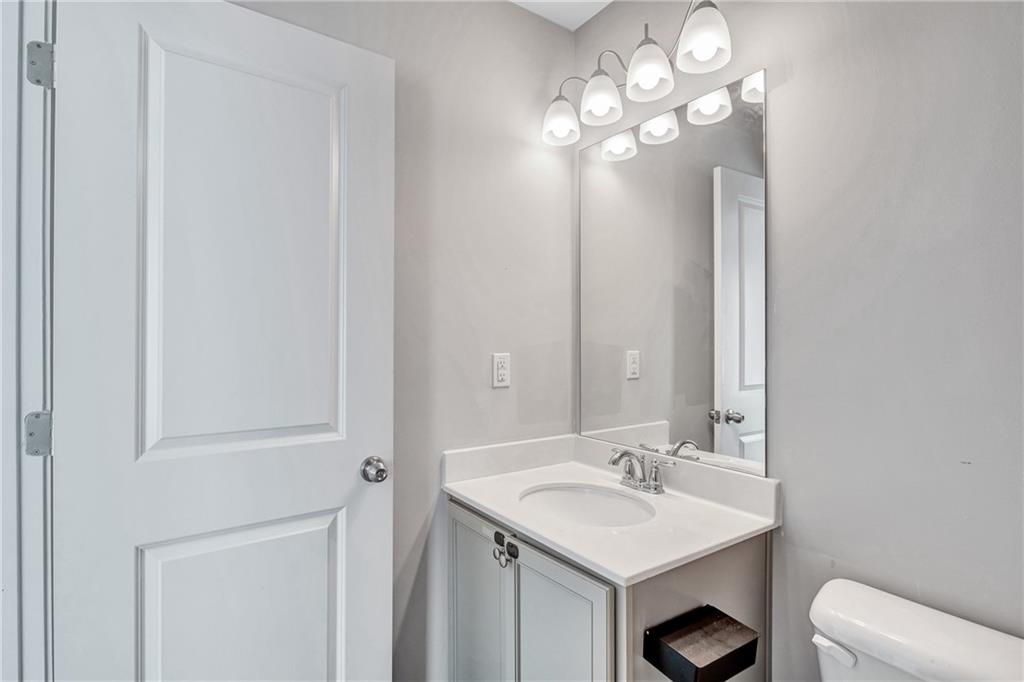 585 McWilliams Road Southeast, Unit 903 Atlanta, GA 30315 - Photo 34 of 37 a bathroom with a sink and a mirror