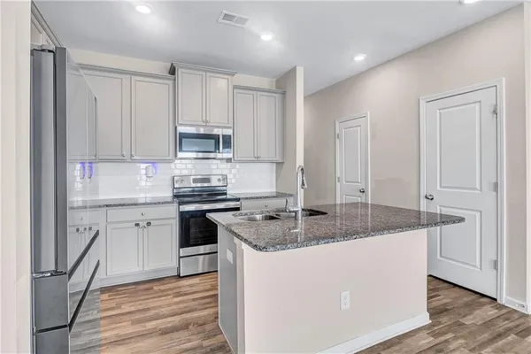 a kitchen with sink and window