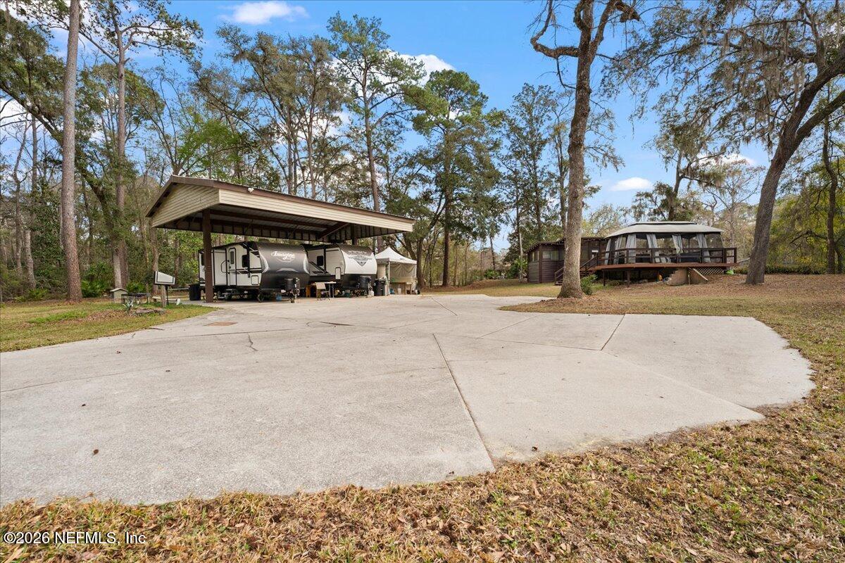 4229 Lazy Acres Road Middleburg, FL 32068 - Photo 19 of 41 a front view of a building with trees