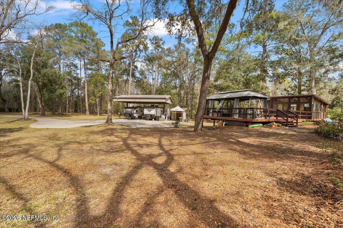 4229 Lazy Acres Road Middleburg, FL 32068 - Photo 21 of 41 a view of street with houses and trees in the background