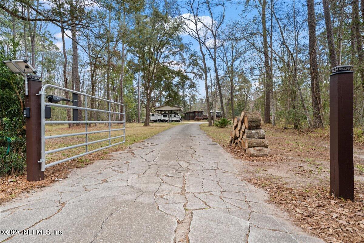 4229 Lazy Acres Road Middleburg, FL 32068 - Photo 28 of 41 a view of a park with swings and a tree