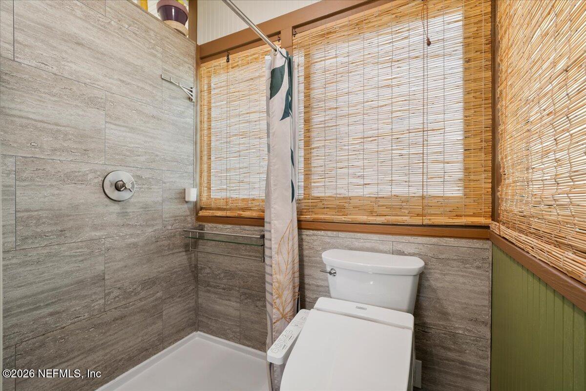 4229 Lazy Acres Road Middleburg, FL 32068 - Photo 9 of 41 a bathroom with a toilet and shower