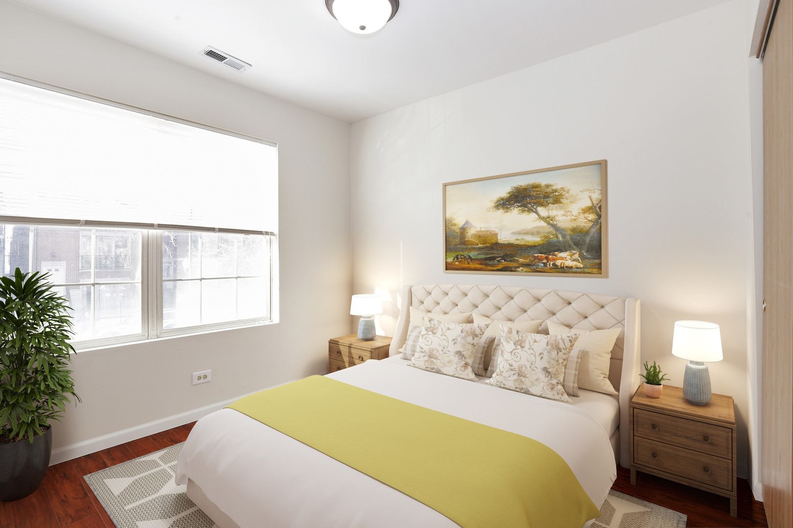 2414 West Harrison Street, Unit E Chicago, IL 60612 - Photo 11 of 15 a bedroom with a bed and a window