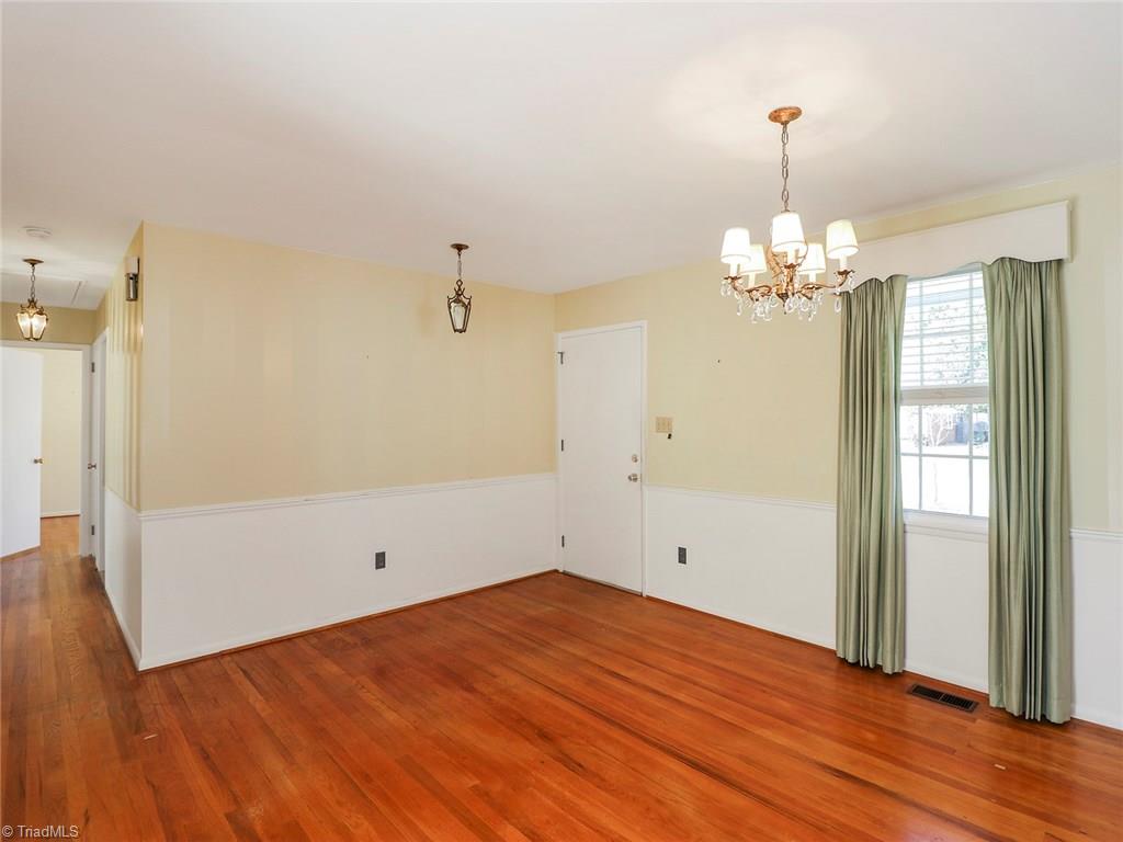 511 Edney Ridge Road Greensboro, NC 27408 - Photo 4 of 26 Dining looking towards hallway that leads to the bedrooms.