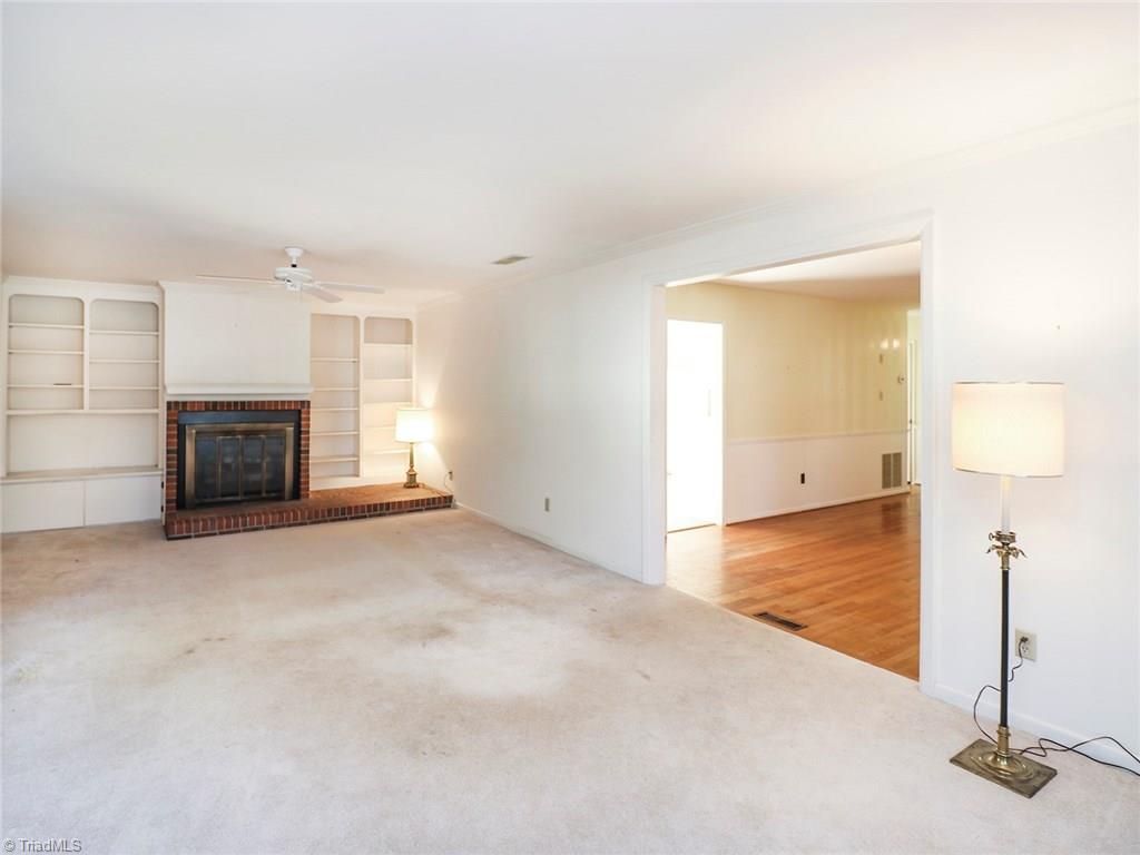 511 Edney Ridge Road Greensboro, NC 27408 - Photo 7 of 26 Living room with built-in shelves.