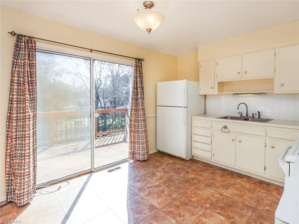 511 Edney Ridge Road Greensboro, NC 27408 - Photo 10 of 26 Kitchen with access to the back deck.