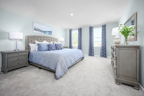 a bedroom with a bed and a couch