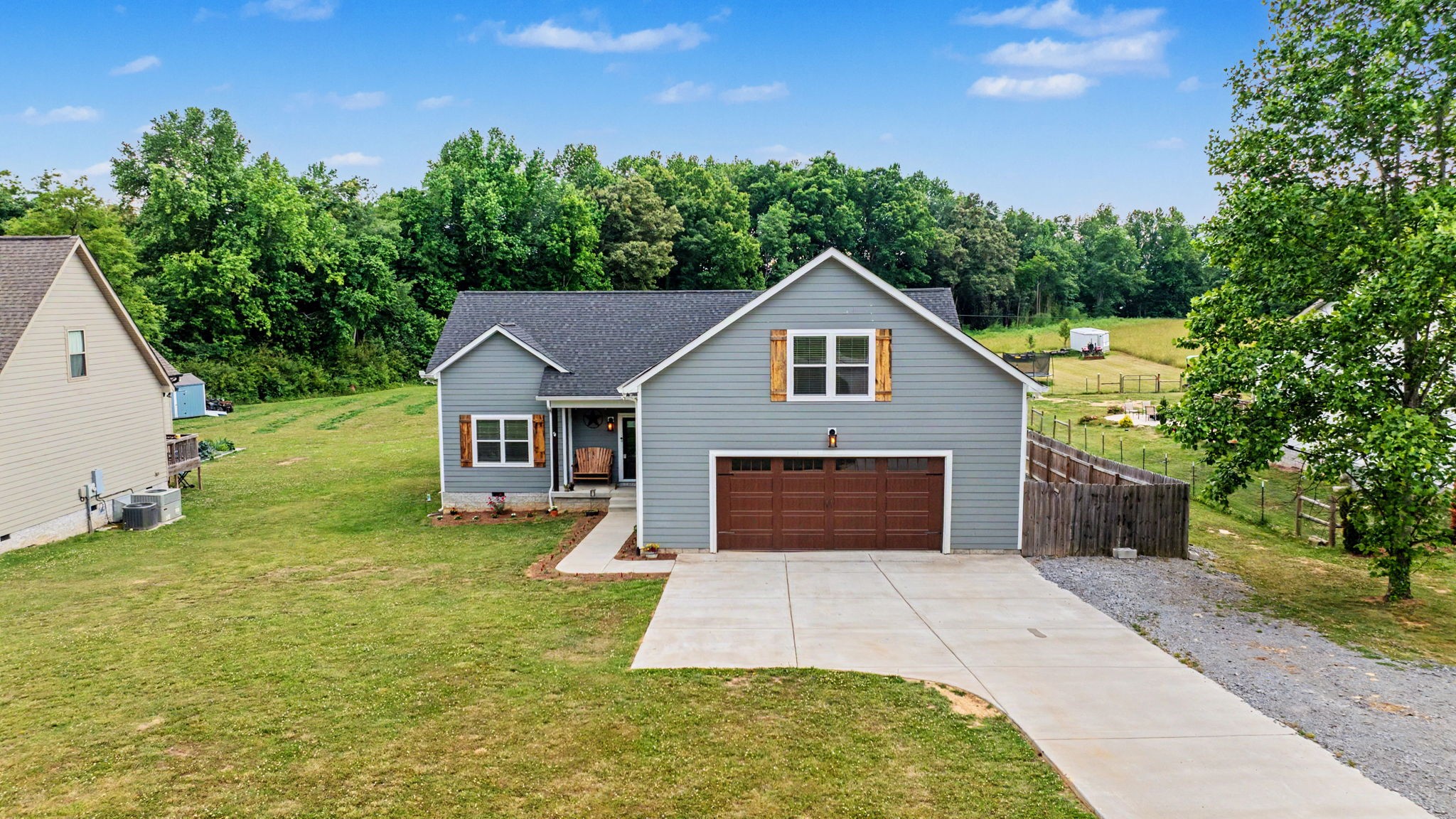 601 King Ridge Road Dowelltown, TN 37059 - Photo 3 of 49 a front view of a house with yard garage and green space