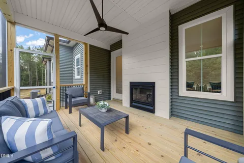 a outdoor living space with furniture and a fireplace