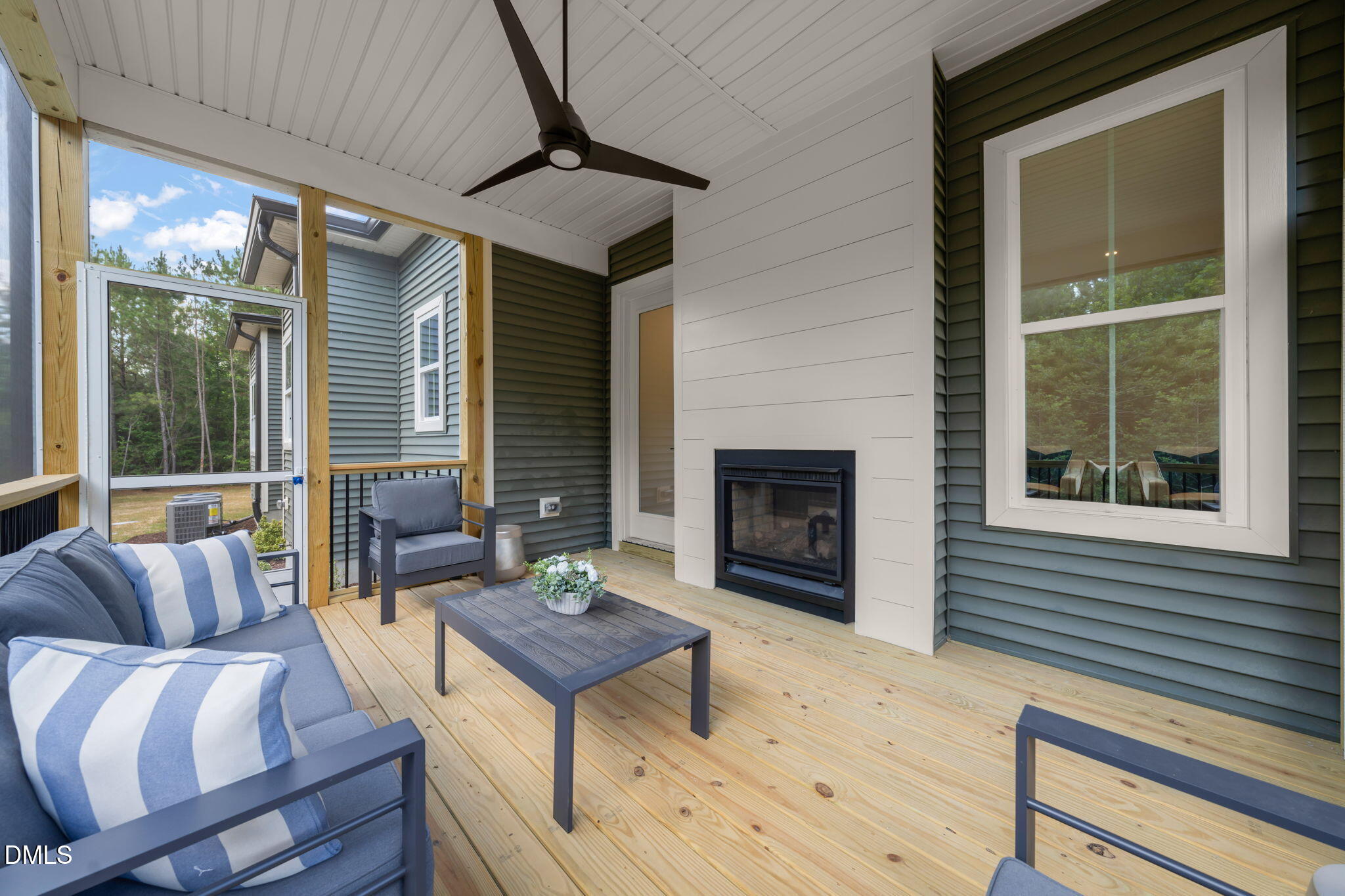 400 Pilot Ridge Road Zebulon, NC 27597 - Photo 43 of 51 a outdoor living space with furniture and a fireplace