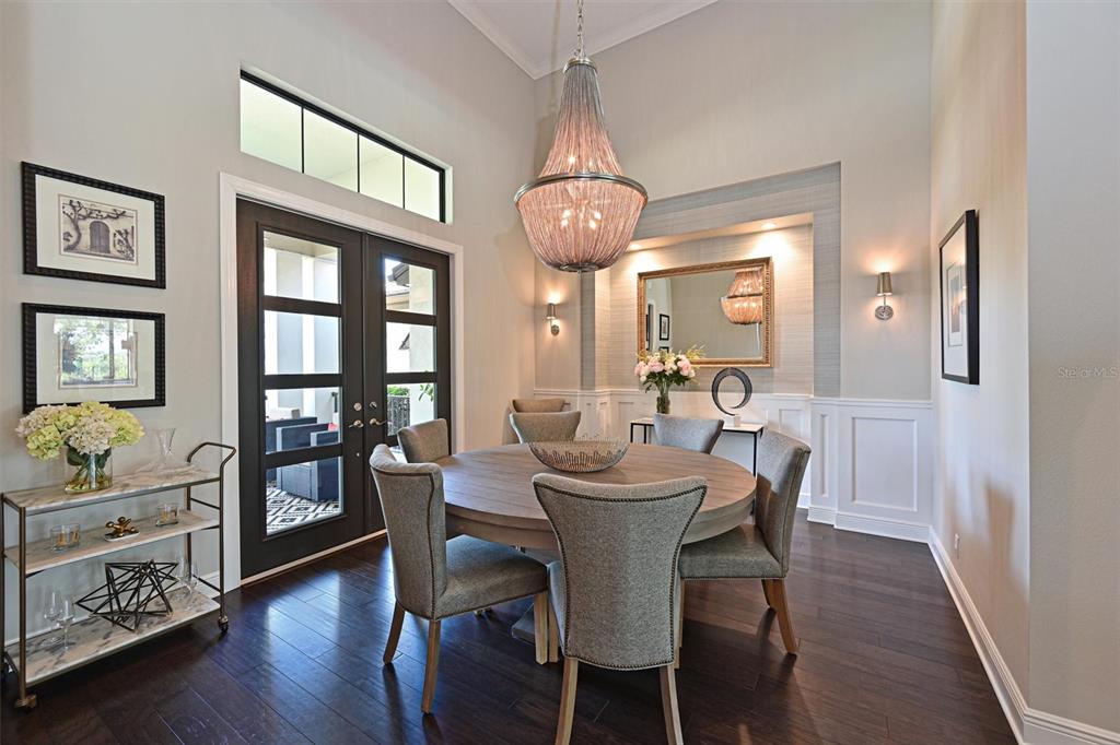 11807 Rive Isle Run Parrish, FL 34219 - Photo 15 of 57 a view of a dining room with furniture and wooden floor