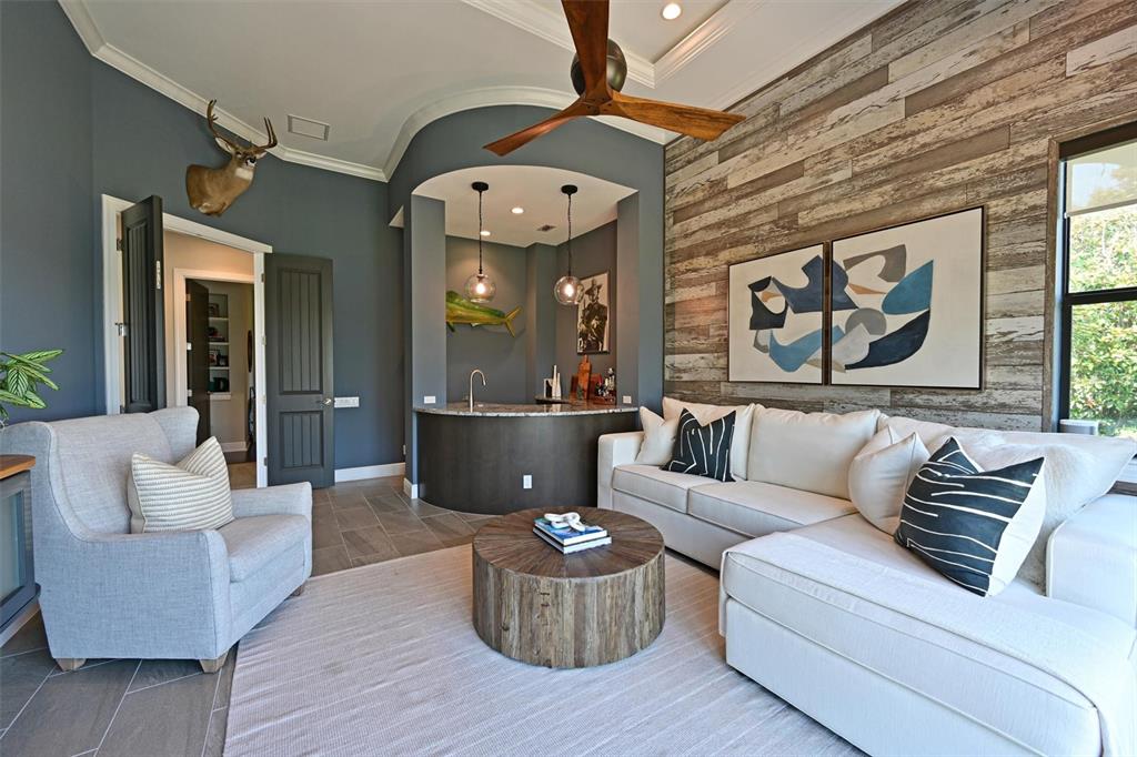 11807 Rive Isle Run Parrish, FL 34219 - Photo 21 of 57 a living room with furniture and a large window