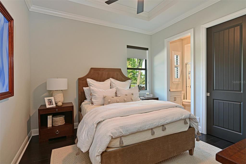 11807 Rive Isle Run Parrish, FL 34219 - Photo 24 of 57 a bedroom with a bed and a window