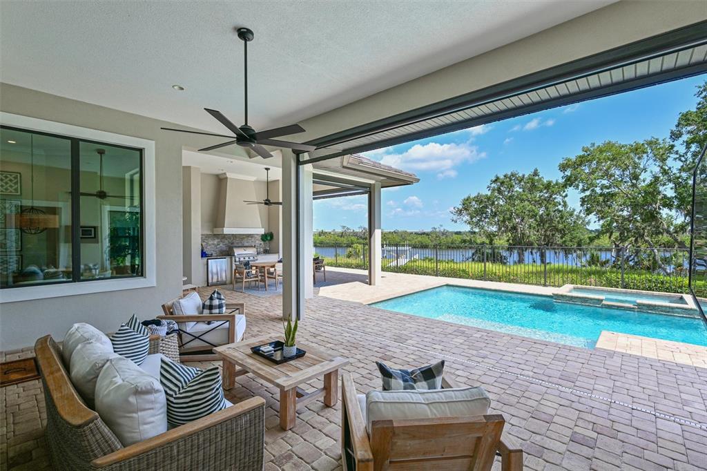 11807 Rive Isle Run Parrish, FL 34219 - Photo 28 of 57 a living room with furniture and a large window