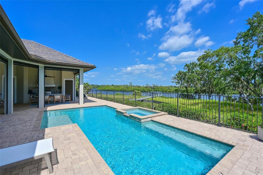 11807 Rive Isle Run Parrish, FL 34219 - Photo 29 of 57 a view of a house with swimming pool and a yard