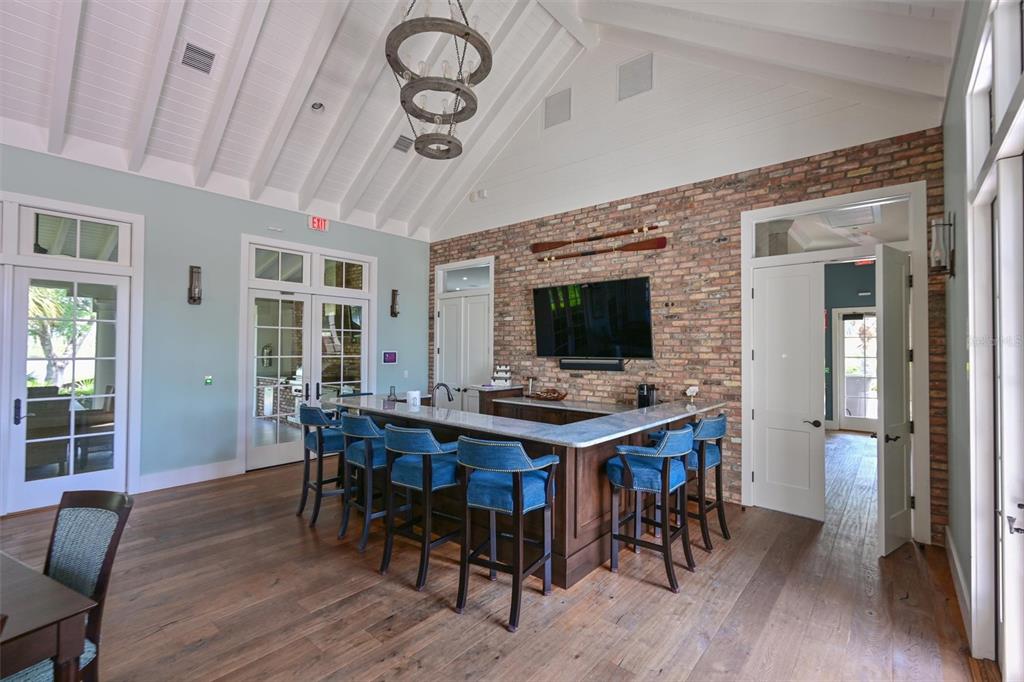 11807 Rive Isle Run Parrish, FL 34219 - Photo 43 of 57 a view of a dining room with furniture window and wooden floor