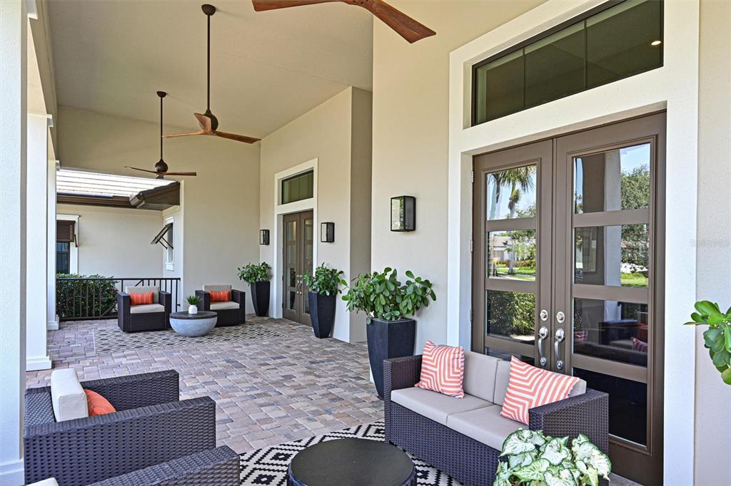 11807 Rive Isle Run Parrish, FL 34219 - Photo 5 of 57 a outdoor living space with furniture and a potted plant