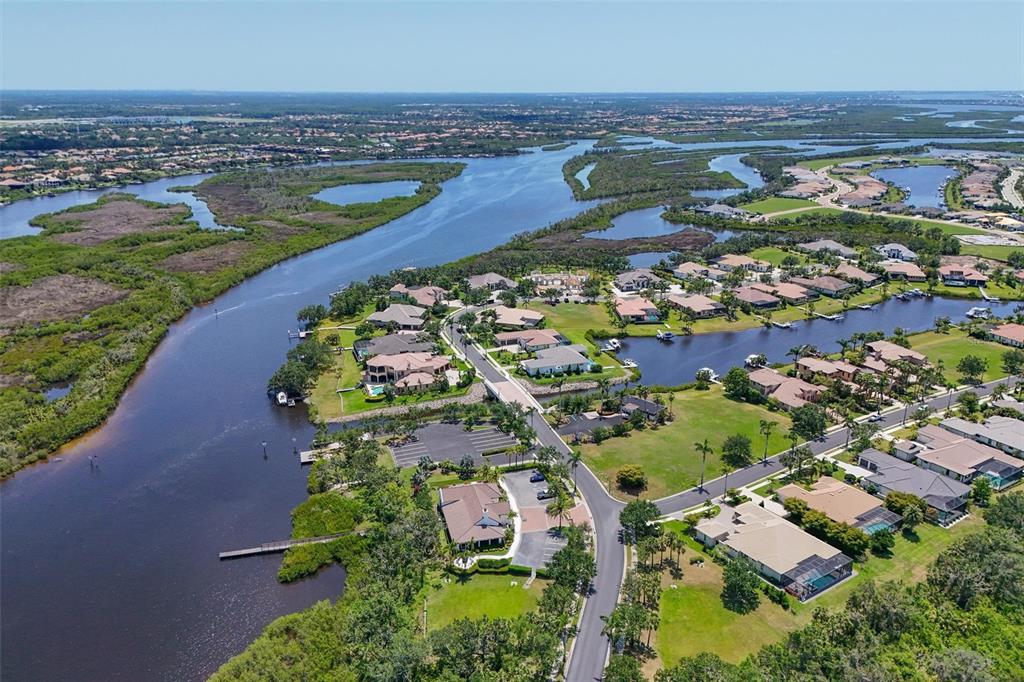 11807 Rive Isle Run Parrish, FL 34219 - Photo 52 of 57 an aerial view of residential houses with outdoor space