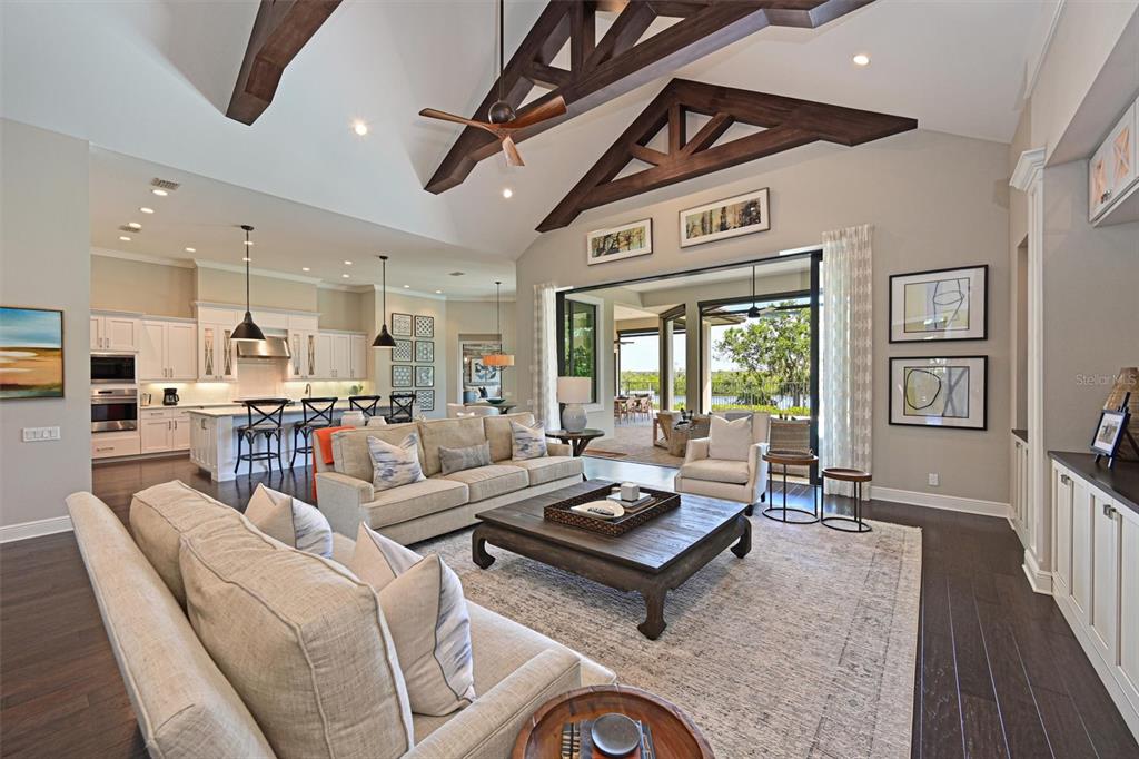 11807 Rive Isle Run Parrish, FL 34219 - Photo 7 of 57 a living room with furniture a rug and a large window