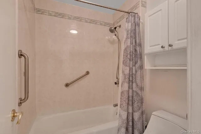 a bathroom with a shower and a tub