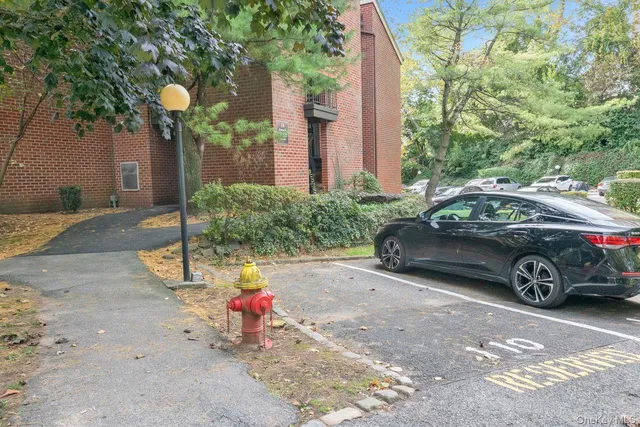 a view of a car is parked in front of a house