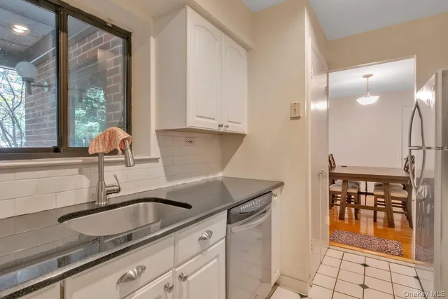 a kitchen with a sink and a window