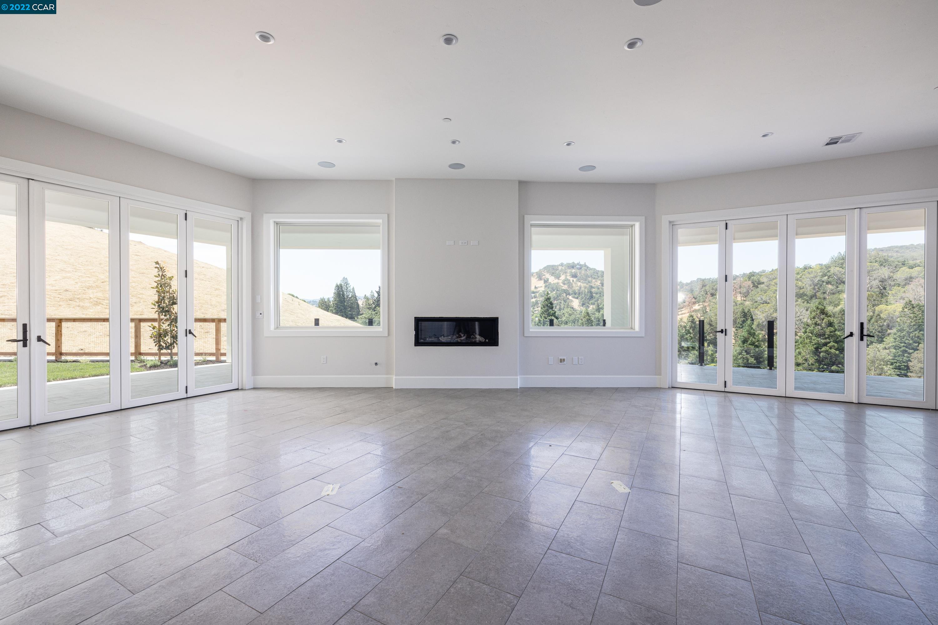 145 Arbor View Lane Lafayette, CA 94549 - Photo 12 of 46 a view of an empty room with a window and wooden floor