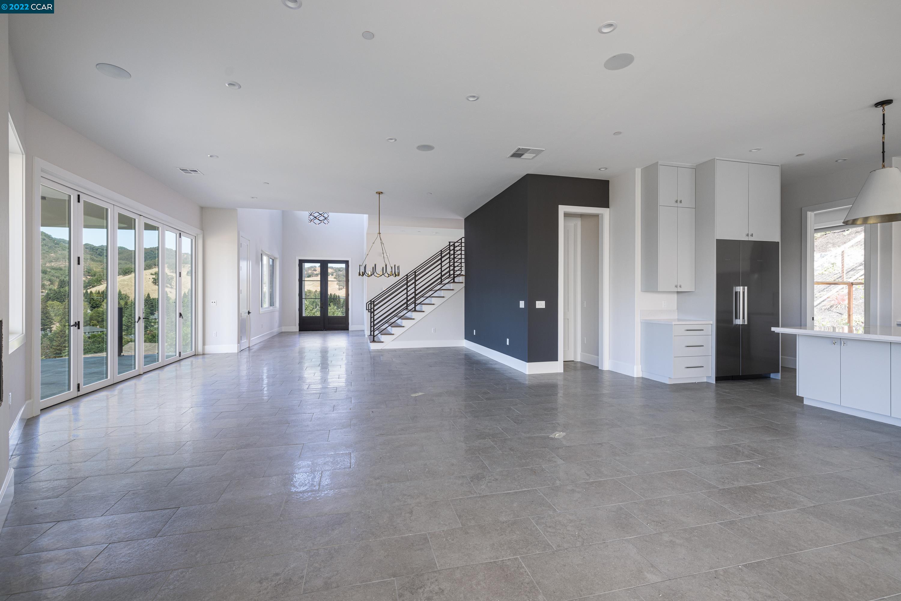 145 Arbor View Lane Lafayette, CA 94549 - Photo 14 of 46 a view of a big room with windows and kitchen view