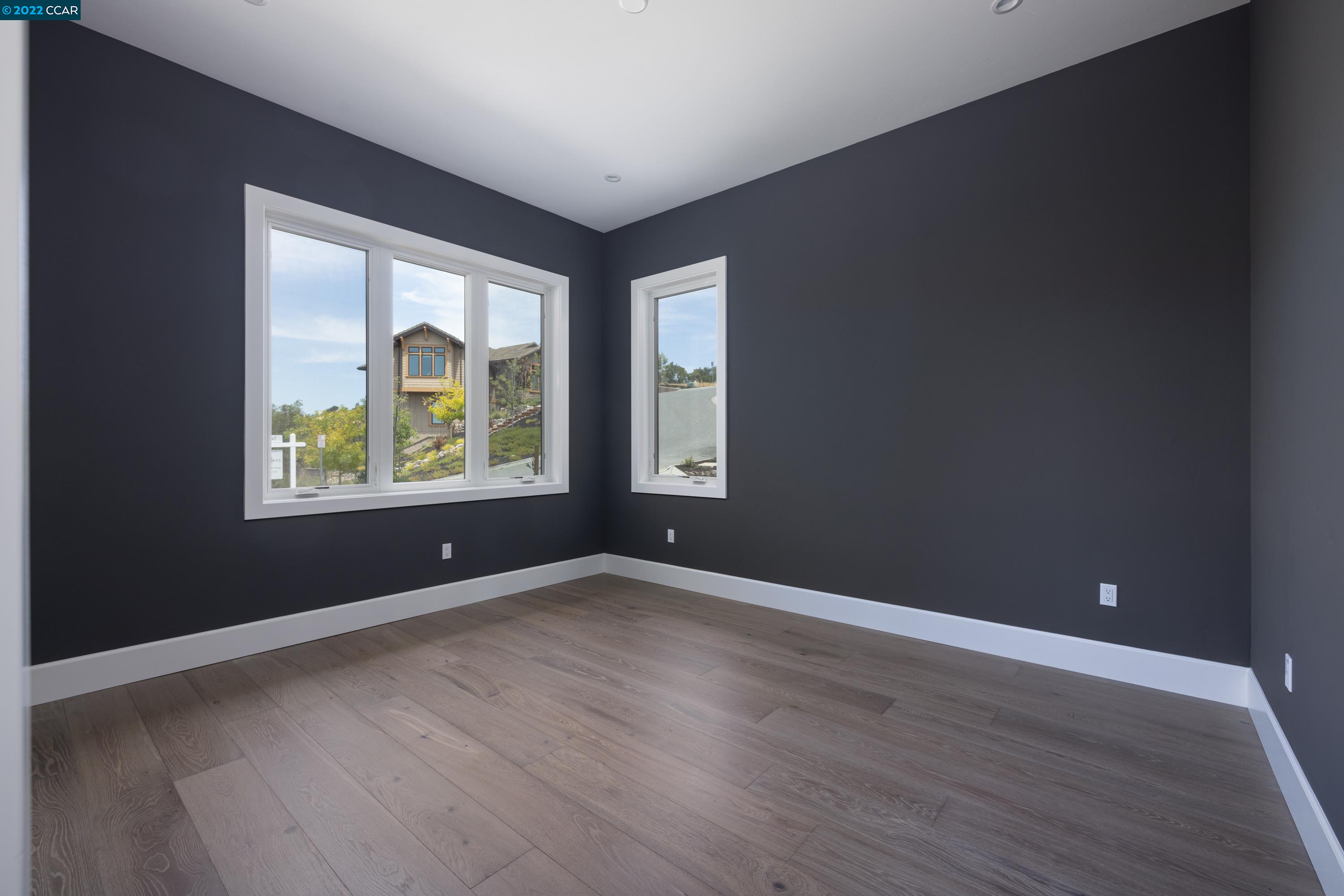 145 Arbor View Lane Lafayette, CA 94549 - Photo 19 of 46 an empty room with wooden floor and windows