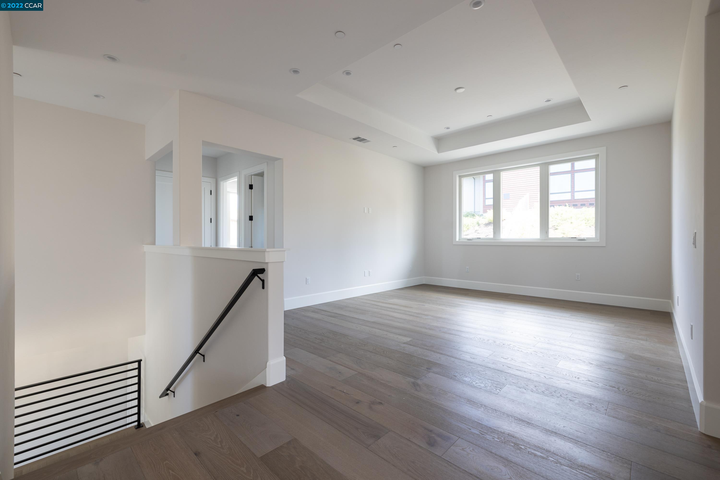 145 Arbor View Lane Lafayette, CA 94549 - Photo 25 of 46 an empty room with wooden floor and windows