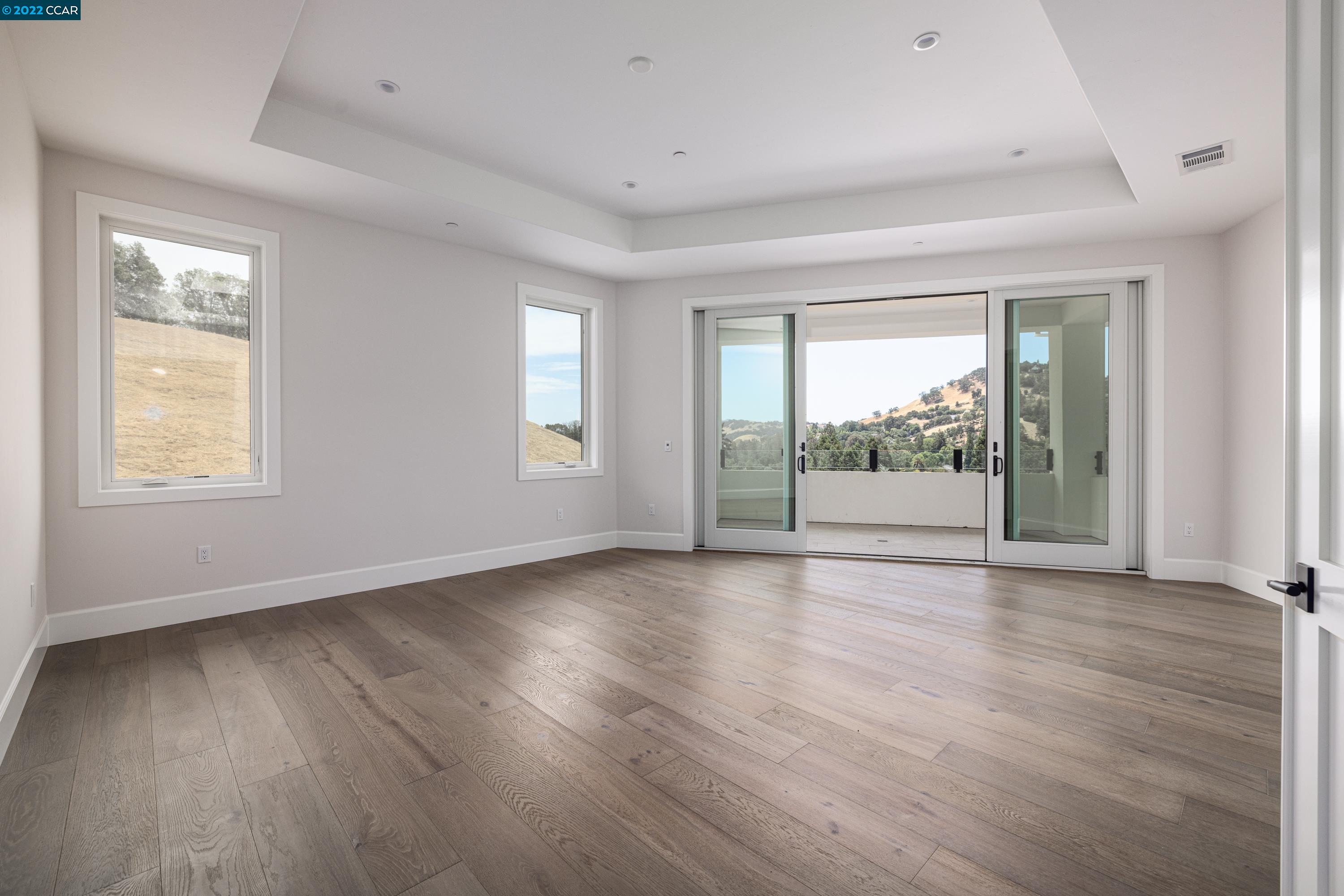 145 Arbor View Lane Lafayette, CA 94549 - Photo 28 of 46 a view of an empty room with wooden floor and a window